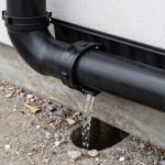 Gutter downspout extension directing water away