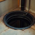 Sump pump installation in basement floor